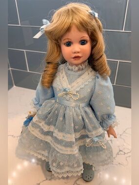 Classic Porcelain Doll in Light Blue Lace Dress